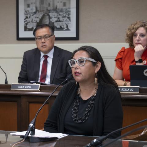 (Background) Assemblymembers Mike Fong and Pilar Schiavo; (Foreground) Morning Star Gali, the Founder and Executive Director of Indigenous Justice