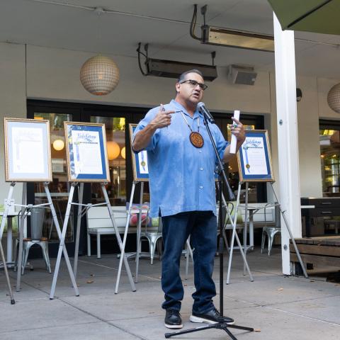 speaking at microphone