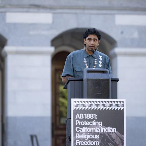 Speaking at podium