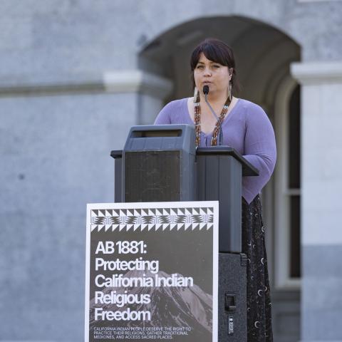 Speaking at podium
