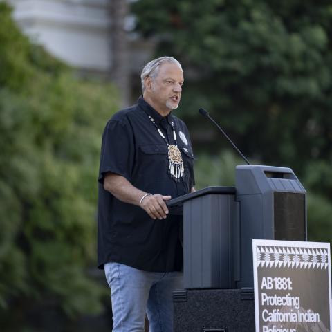Speaking at podium