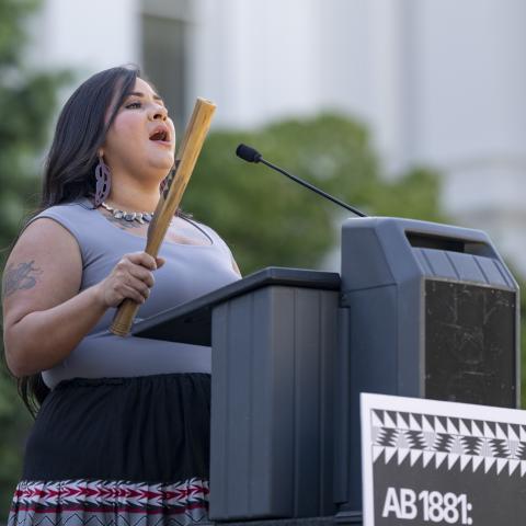 Speaking at podium