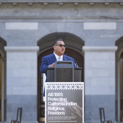 Speaking at podium