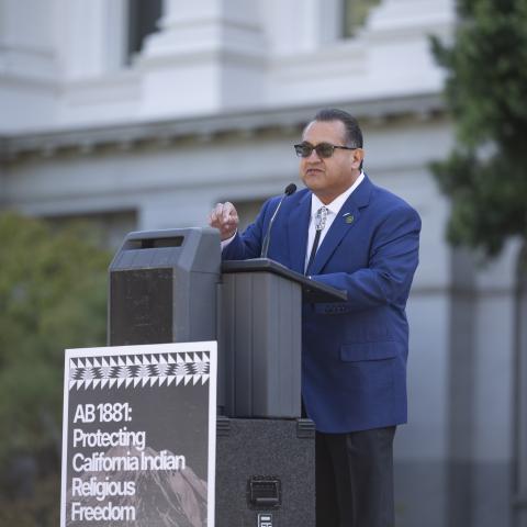 Speaking at podium