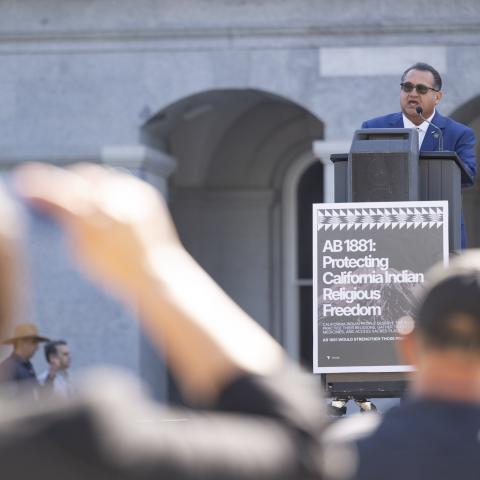 Speaking at podium