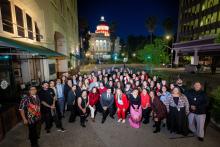 Group Photo in front of illuminated Capitol Dome.