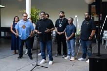 speaking at microphone