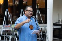 speaking at microphone