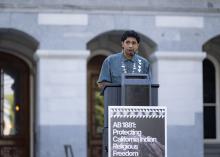 Speaking at podium