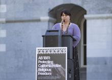 Speaking at podium