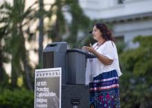 Speaking at podium