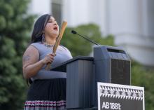 Speaking at podium